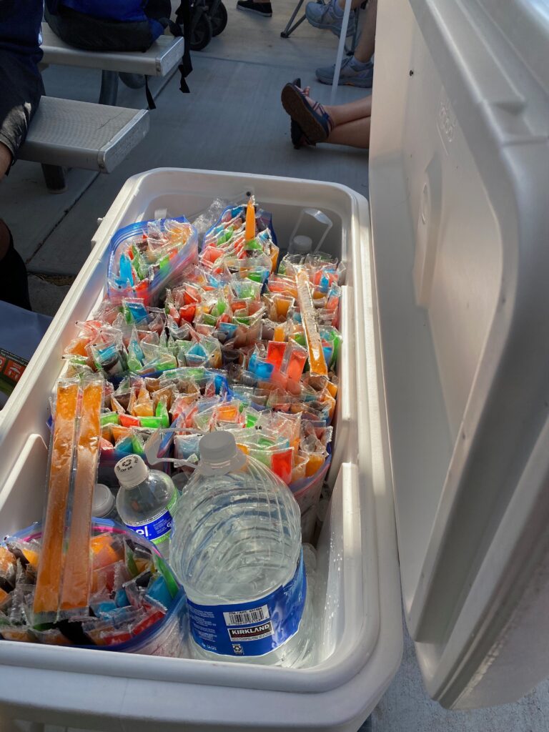 Cooler filled with Otter Pops at the Grand Canyon State Games Swimming Championships